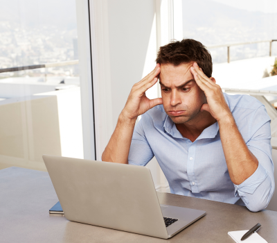 confused person in front on laptop